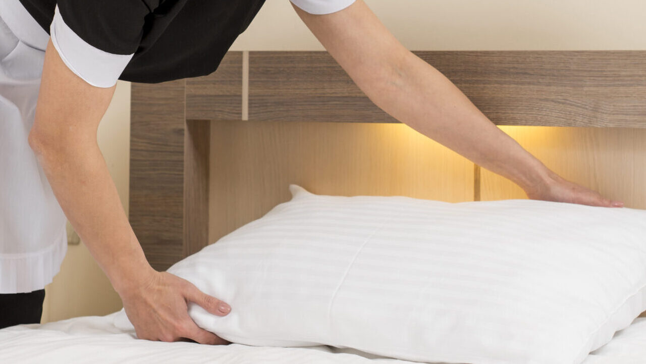 chambermaid cleaning hotel room scaled e1722515429639