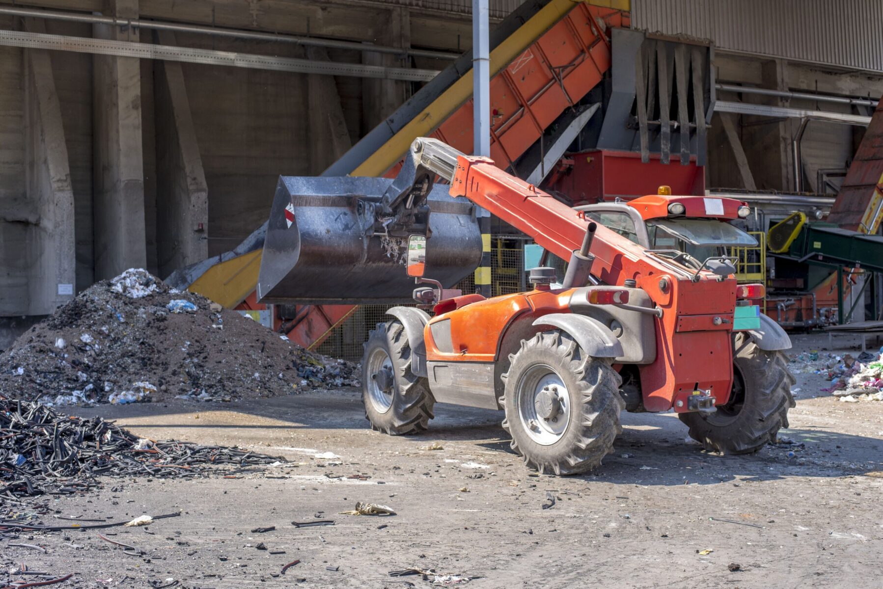 loader transporting soil waste materials waste treatment plant scaled e1722859772227